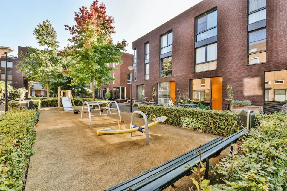 Playground in courtyard of apartment building.